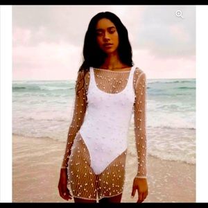 White pearl swim coverup.